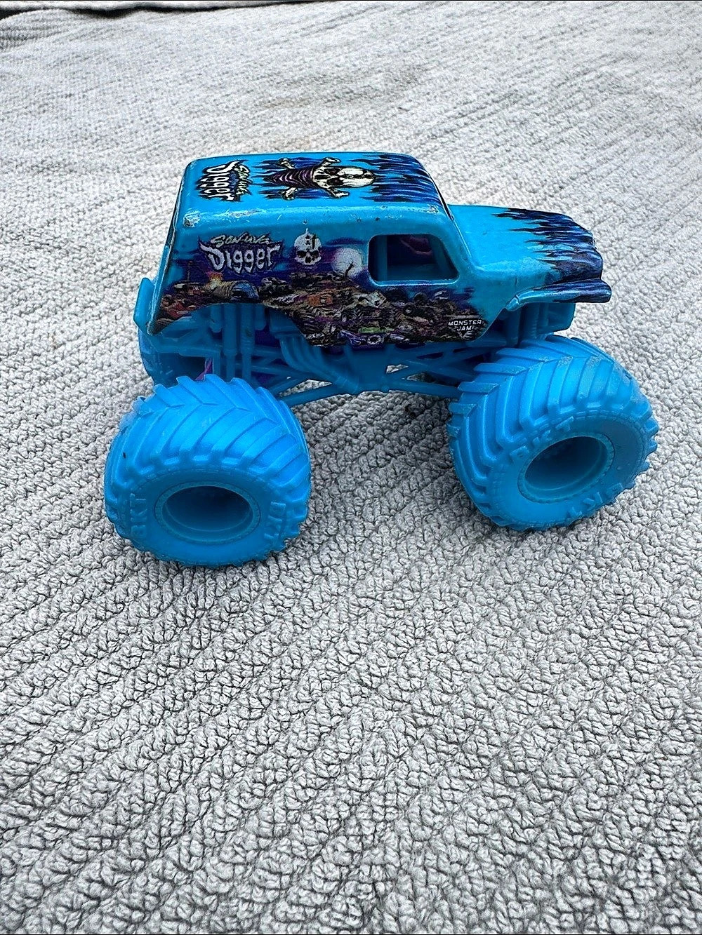 Spin Master Monster Jam Son-Uva Digger with Blue Tires Blue Monster Truck Toy